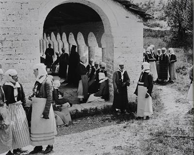 Countrywomen in a church courtyard. Photographic copy from a glass plate of Fred Boissonnas, c. 1903-1923. The glass plate is at the Museum of Photography in Thessaloniki.