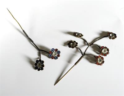 &quot;Tremovelones&quot; (pins ending in stems and flowers) from Ios island. They are made of colorful stones. They used to attach and embellish the headband aiming to attract attention and &quot;prevent evil&quot;.